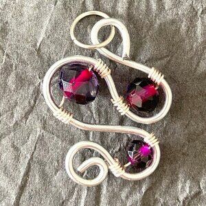 Deep Purple Faceted Glass Bead Adorned Stainless Steel Swirl Pendant